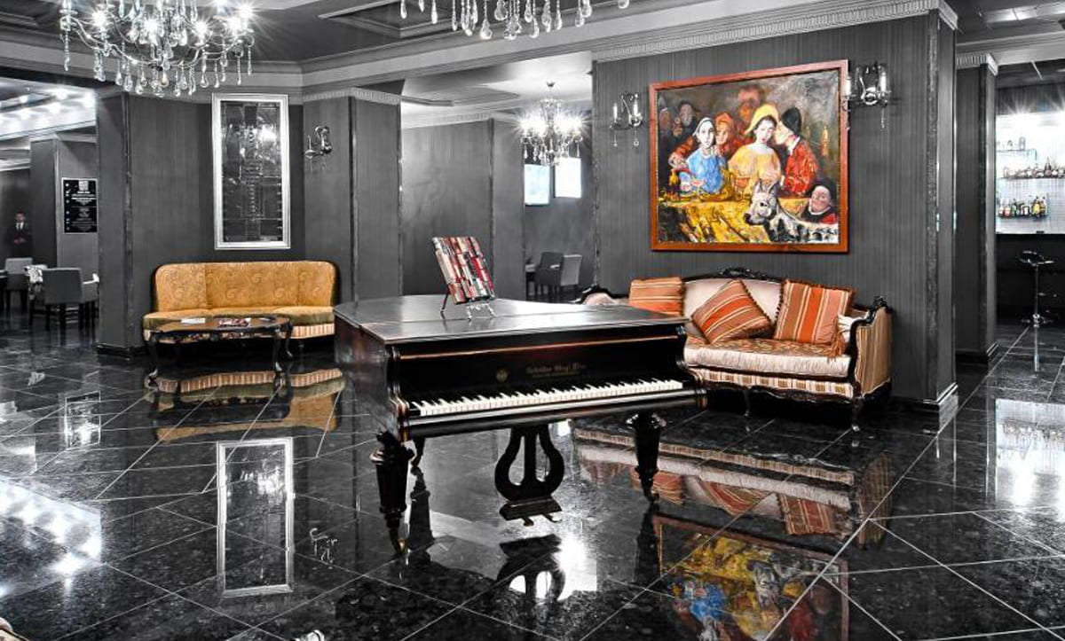 Stylish armchair and ottoman in Alfavito Hotel suite - yavorina.com.ua