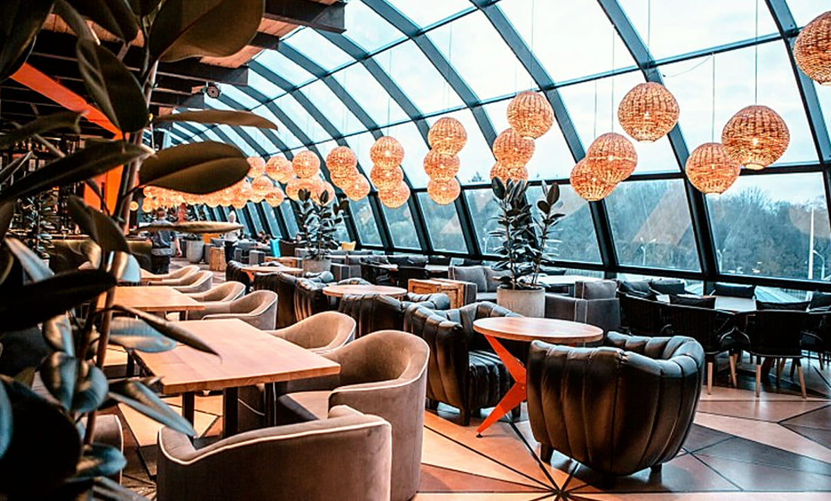 Stylish wooden tables designed for Aura Restaurant by Yavorina