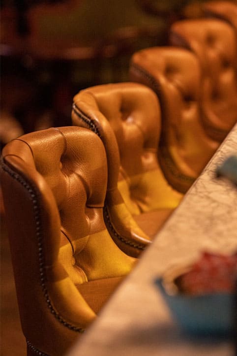 Bespoke leather armchairs in the private dining area of Bellboy - yavorina.com.ua